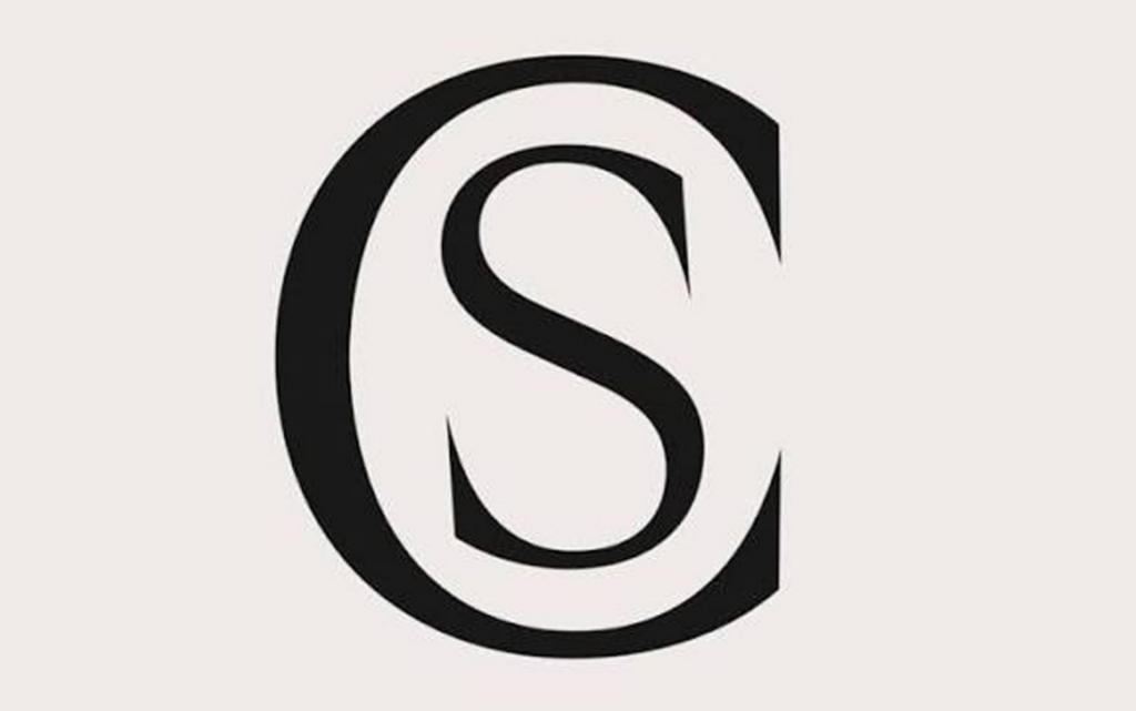 A bold black letter S is centered within a larger bold black letter C on a light background.